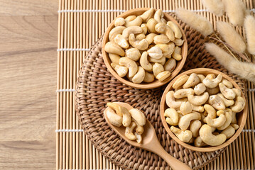Raw cashew nuts in wooden bowl, Food ingredient, Table top view