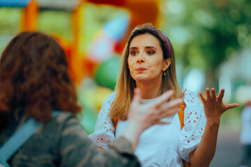 Women Fighting Outdoors Reprimanding each other. Strangers starting a conflict on the street from...