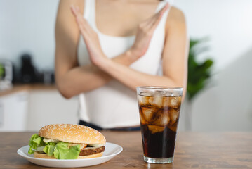 women avoid to eat soft drink and junk food.