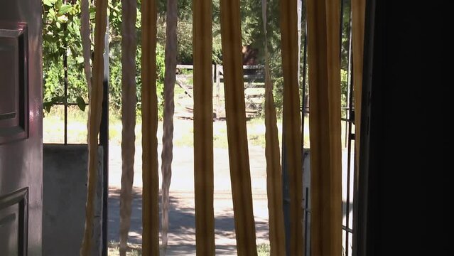 Door with Plastic Strip Curtains in a Rural House in La Pampa Province, Argentina.
