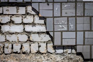 Decorative, facing tiles fell off the brick wall.
The destroyed wall, the consequences of the war