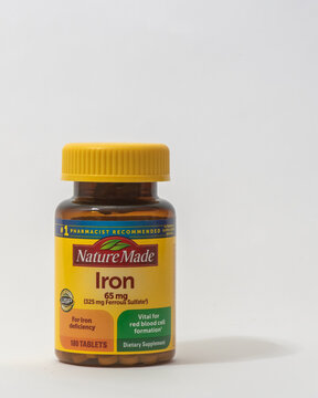 Davis, CA, 11 May, 2024. Bottle of Nature Made Iron supplement on white background, centered, front view, centered.   