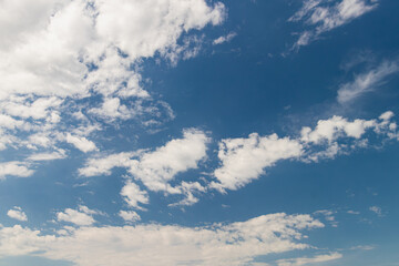 Beautiful white puffy clouds against blue sky