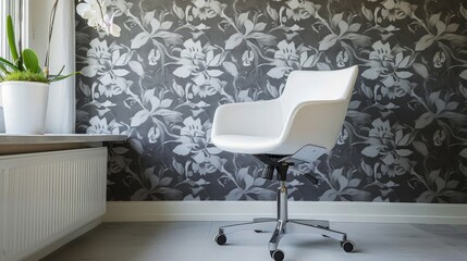 A contemporary office space highlighted by an untamed gray print wallpaper and a white, minimalist modern chair, creating a bold and stylish work environment.