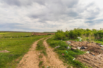 Pollution concept. Spontaneous uncontrolled landfill. Lytachi Ukraine 06.05.2024