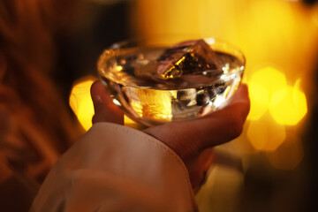 woman with alcoholism holding glass of wine