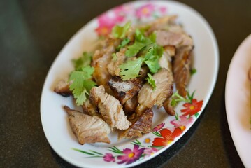 grilled pork neck in white plate