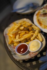 french fried with mayonnaise and tomato sauce