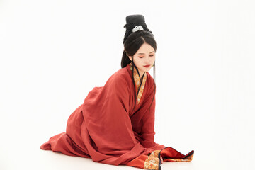 Fototapeta premium A woman wearing ancient Chinese clothing against a white background.