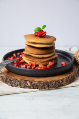 Stack of pancakes hotcakes with honey and strawberries breakfast food american style