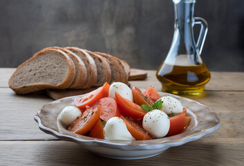 Mediterranean diet: caprese salad with tomatoes and mozzarella cheese