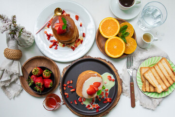 Stack of pancakes hotcakes with honey and strawberries breakfast food american style