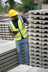 Portrait African engineer man working at precast cement outdoor factory	