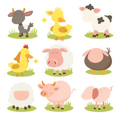 Fototapeta premium A set of farm animals standing in a grassy field