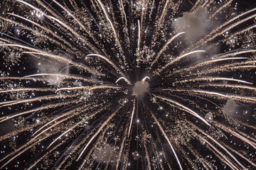 Platinum and charcoal sparkling explosion with a patriotic background.