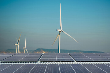 Solar cells and wind turbines produce electricity, clean energy.