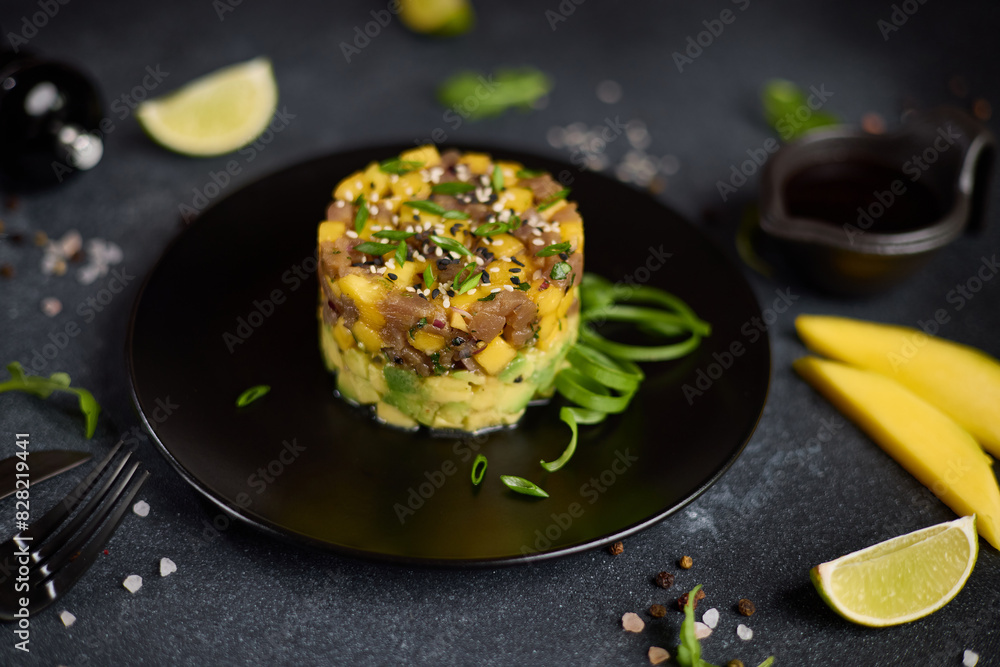 Canvas Prints Traditional tuna and mango tartare on black ceramic plate