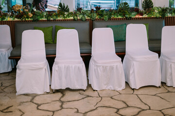 Elegant guest chairs arranged for a wedding ceremony, providing a stylish and comfortable seating area