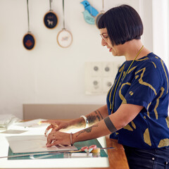Craftswoman, light table and designer drawing in studio, working and creative professional with...