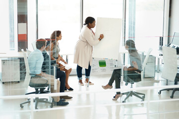 Woman, presentation and group in workplace or meeting, business planning and white board...