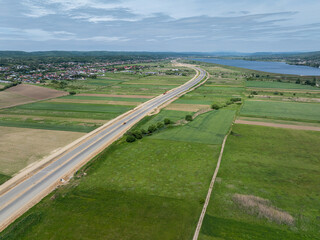 Highways under construction of Romania. Aerial view of A1 Bucuresti Pitesti Curtea de Arges Sibiu highway during construction. High speed roads infrastructure industry.