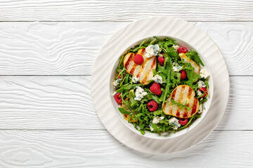 grilled pear salad with cheese, arugula, berries