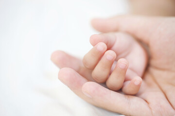 mother and father take care newborn with warmth