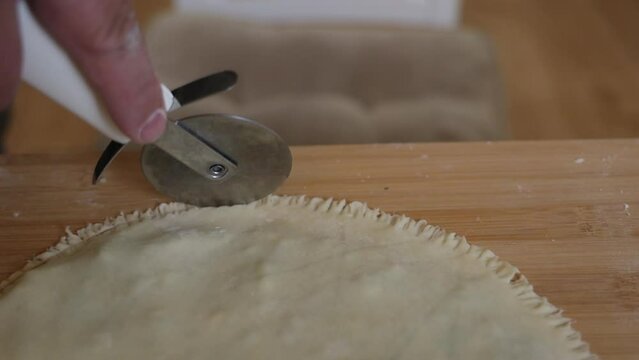 a male chef makes kutab dough in a home kitchen