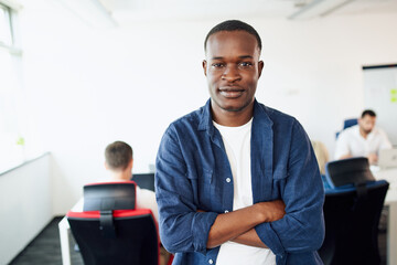 Portrait of casual young African man at modern office