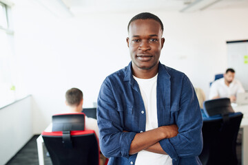 Fototapeta premium Portrait of casual young African man at modern office