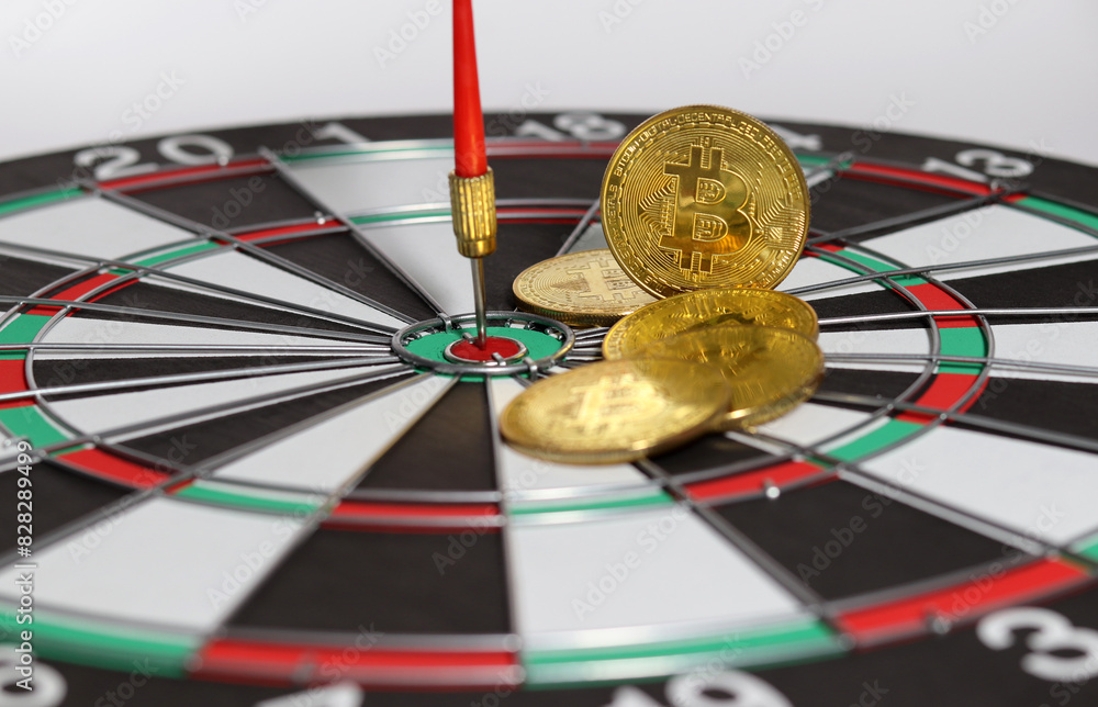 Wall mural gold bitcoin on a dartboard. bitcoin investments, mining concepts. cryptocurrency market gambling ab