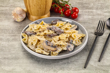 Italian cuisine - farfalle with mushrooms