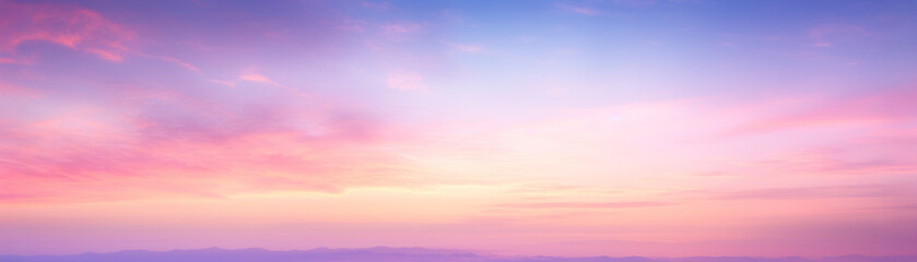 Fototapeta premium Beautiful pastel sunset sky with soft clouds in shades of pink, purple, and blue, creating a serene and calming landscape.