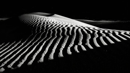 Desert dunes at sunset, dramatic shadows casting intriguing patterns