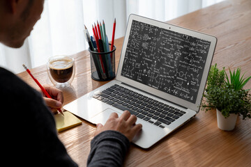 Mathematic equations and modish formula on computer screen showing concept of science and education