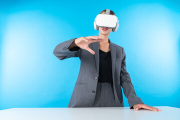 Project manager wearing VR headset and standing while holding innovation technology hologram....