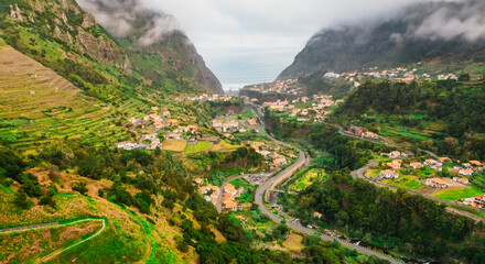 Fototapeta premium Rainy day with aerial view of Capelinha de Nossa Senhora de Fatima, Sao Vicente, Madeira Island, Portugal