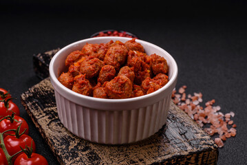 Delicious soy meat with tomato sauce, salt and spices