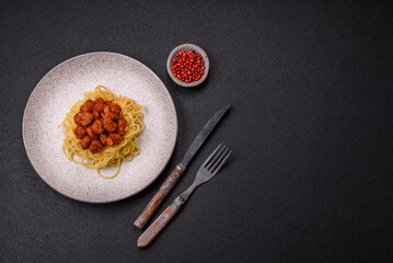 Delicious paste with soy meat with tomato sauce, salt and spices