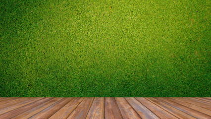 Wooden floor and golf course background. Fresh spring green golf course with wood floor. Beauty...