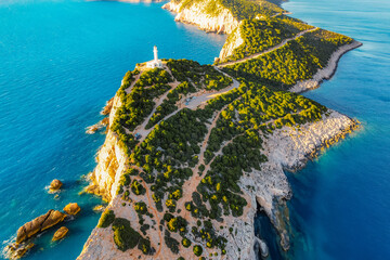 Lighthouse on the cliff. Seascape of Cape Lefkatas with old lighthouse on Lefkada island, Greece....