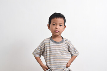 Image of Asian child posing angry face on white background. portrait of an Asian boy