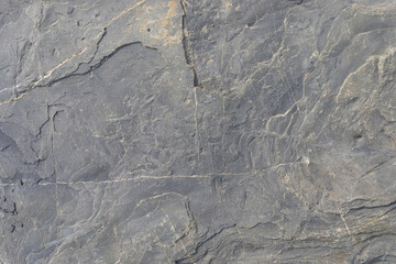 Stone texture worn by the wind and the sea of ​​the coast located on a wild beach.