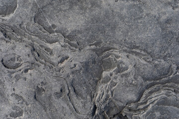 Stone texture worn by the wind and the sea of ​​the coast located on a wild beach.