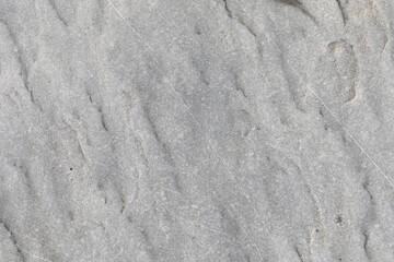 Stone texture worn by the wind and the sea of ​​the coast located on a wild beach.