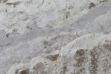 Stone texture worn by the wind and the sea of ​​the coast located on a wild beach.