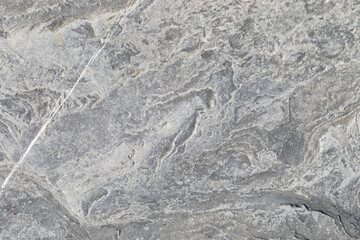 Stone texture worn by the wind and the sea of ​​the coast located on a wild beach.