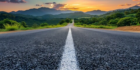 A long and winding road stretches out into the distance, surrounded by lush green hills and a beautiful sunset sky. AI.
