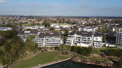 Obraz premium Aerial drone view of waterfront property and houses