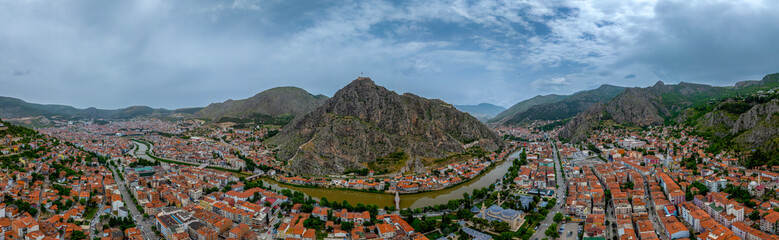 Fascinating view of the city of Amasya, also known as the city of princes. wonderful clouds coming out of the mountains. YESILIRMAK river.